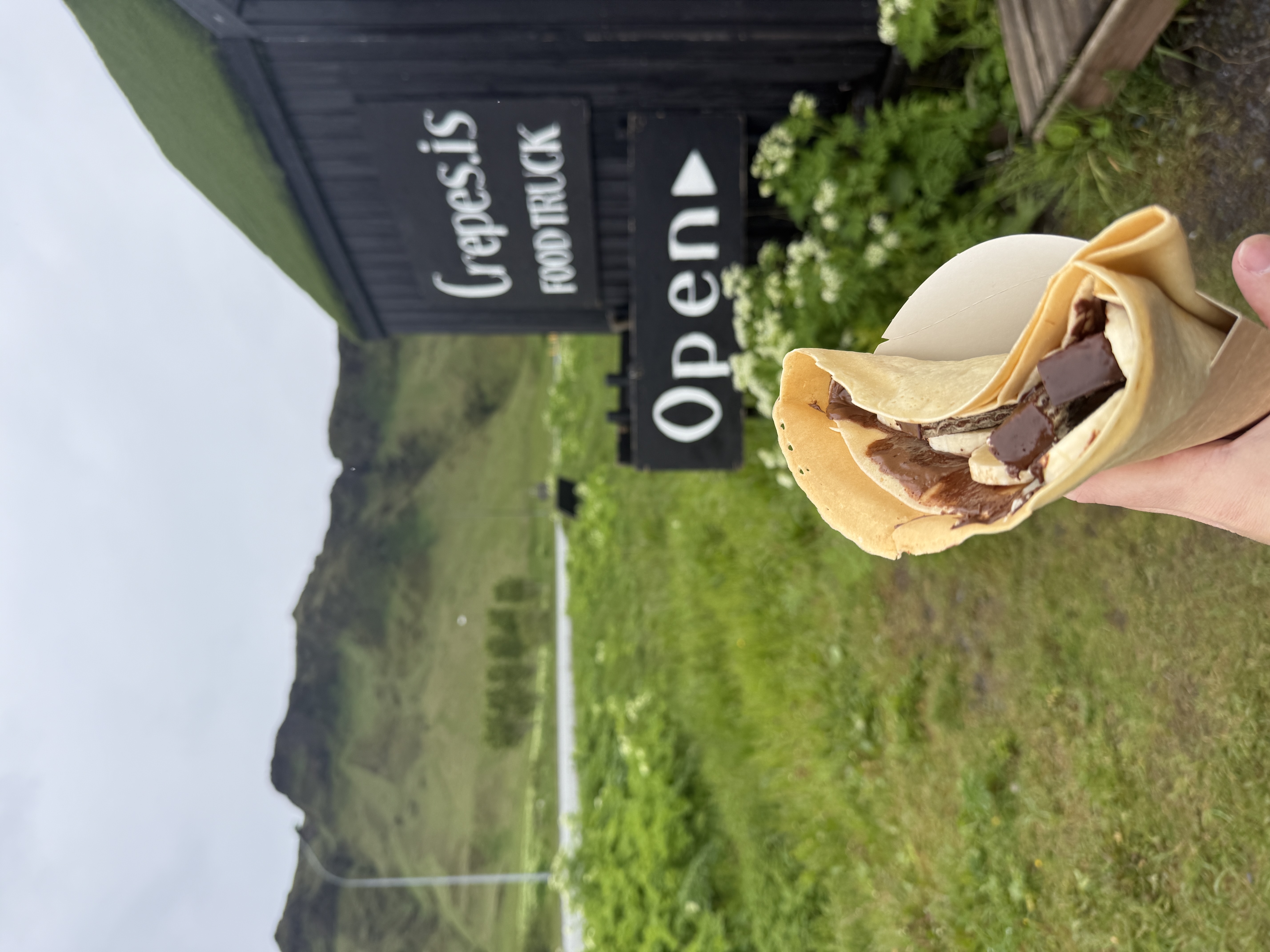 A sweet crepe in front of an Icelandic food truck